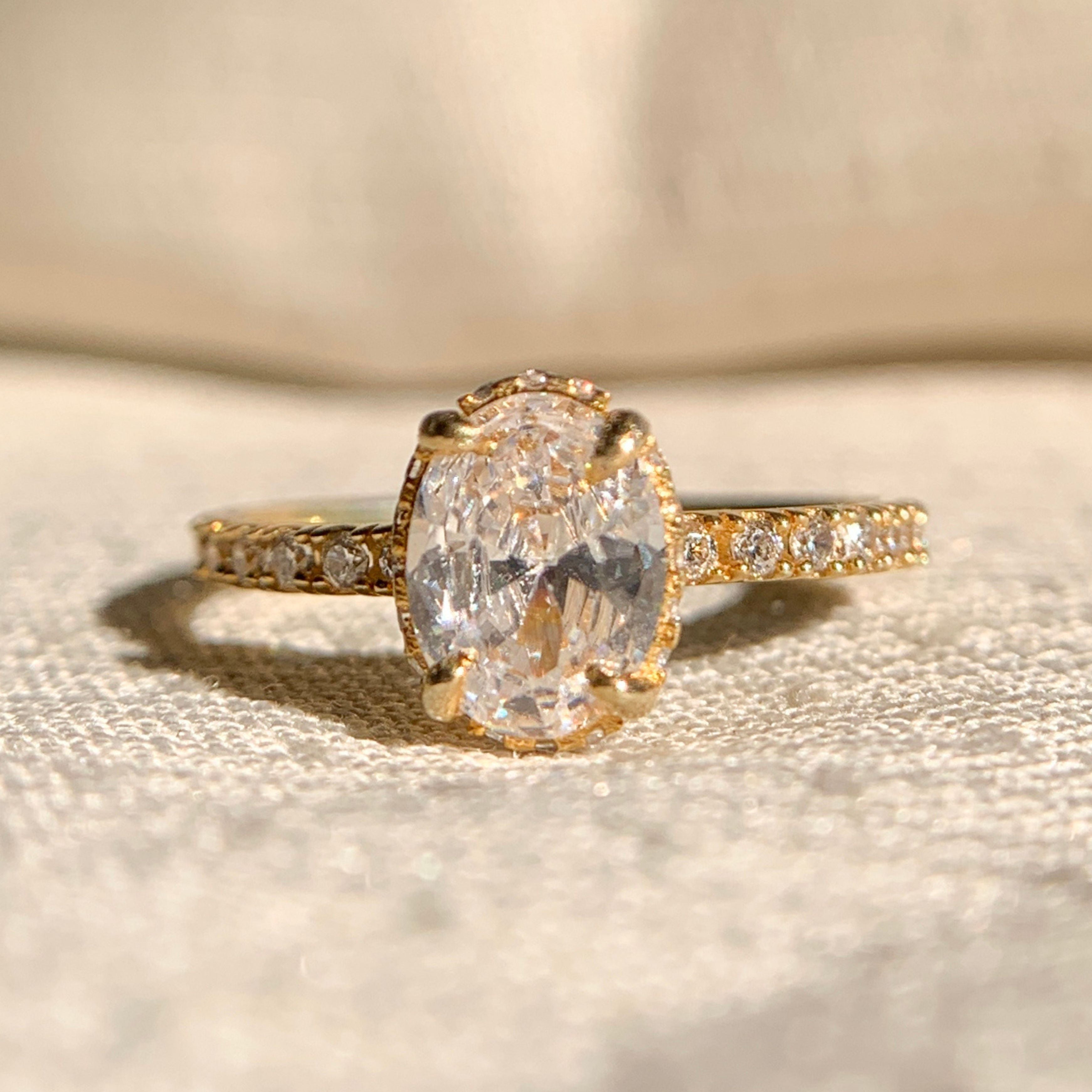 Oval Cut Hidden Halo Engagement Rings